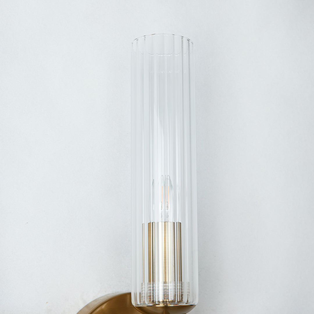 Antique Bronze Tube Sconce with Ribbed Glass Shade and Cylindrical Design for Versatile Indoor Lighting