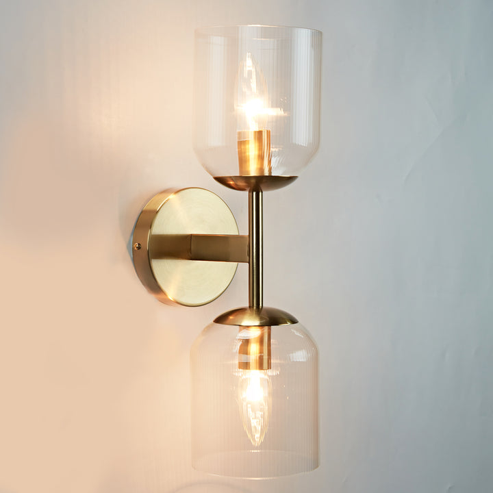 Antique Bronze Double Sconce with Ribbed Glass Shades and Bell-Shaped Design for Durable Indoor Lighting